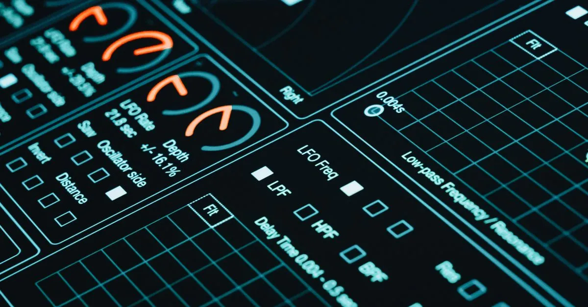 Close-up of a digital interface showcasing futuristic graphs and data analytics in low light.