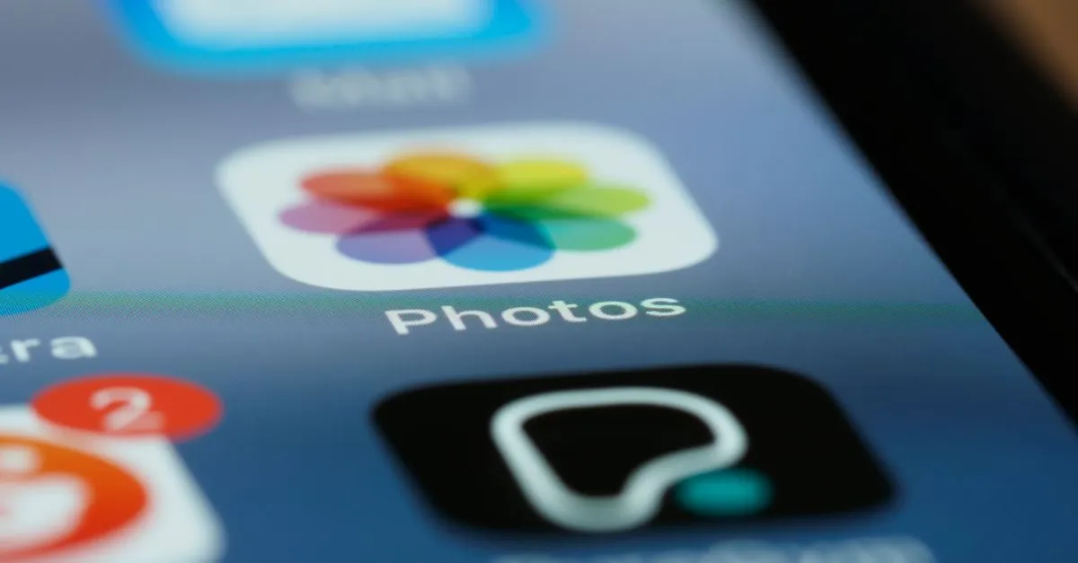 Detailed shot of smartphone screen showing app icons, including photos app.