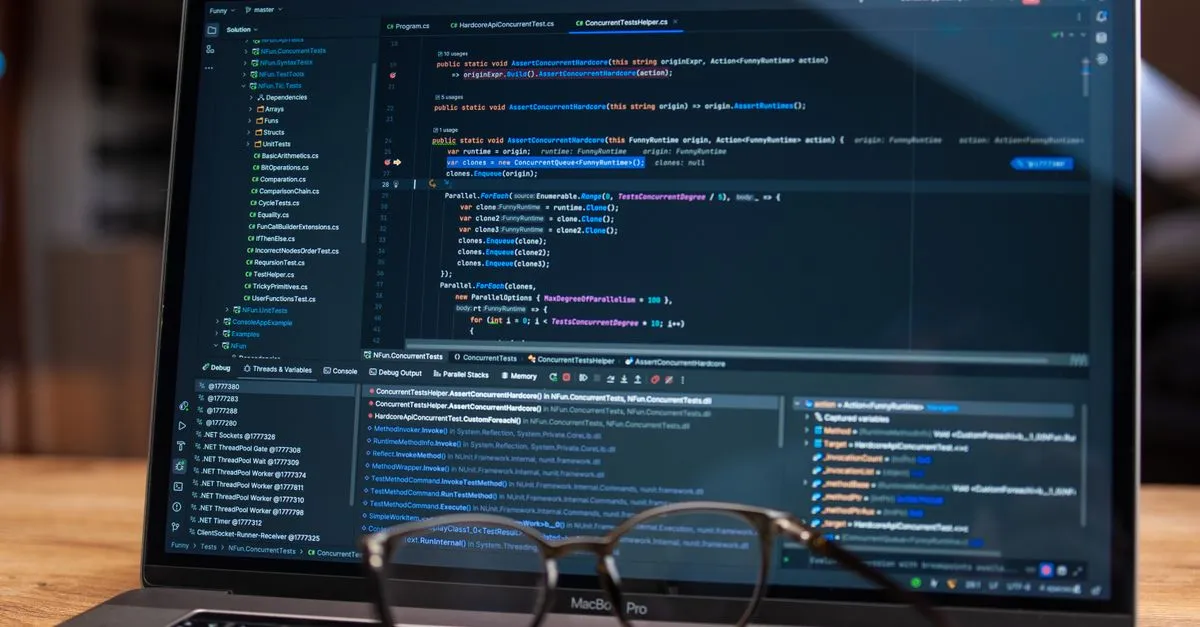 Laptop screen showing debugging software with code, perfect for tech and software development themes.