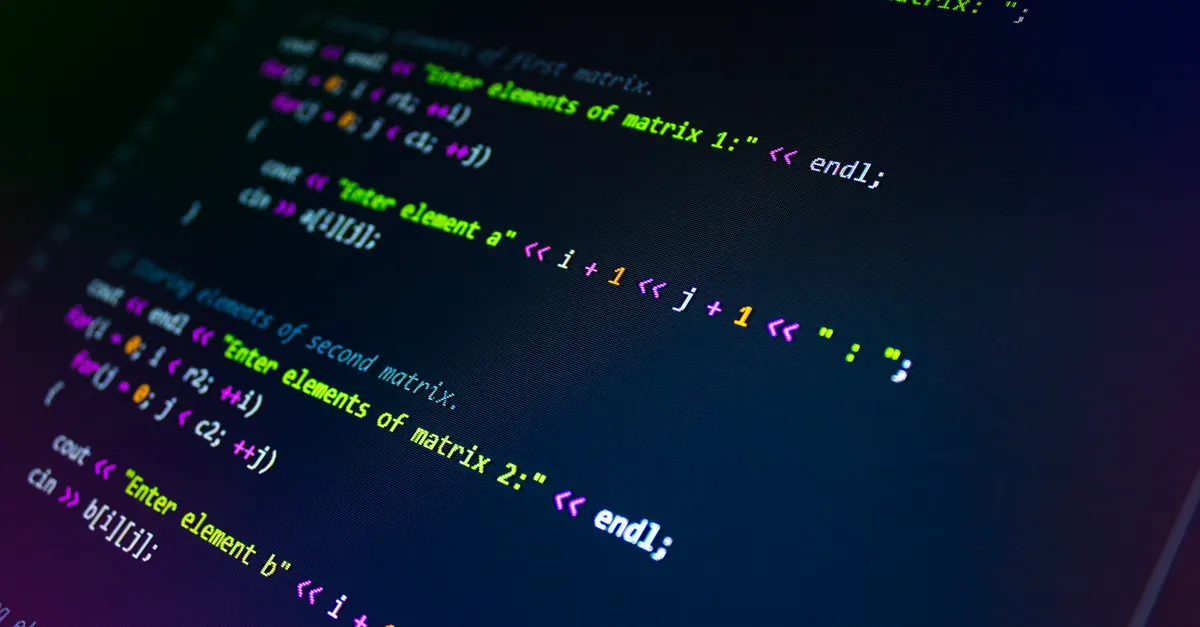 Close-up of colorful programming code displayed on a monitor screen.