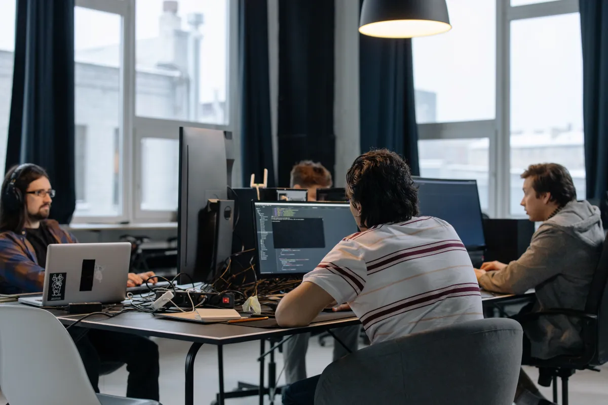 Team of developers fixing a website together