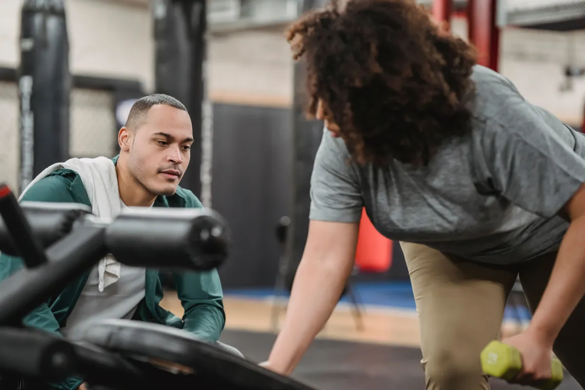 Personal trainer coaching a client