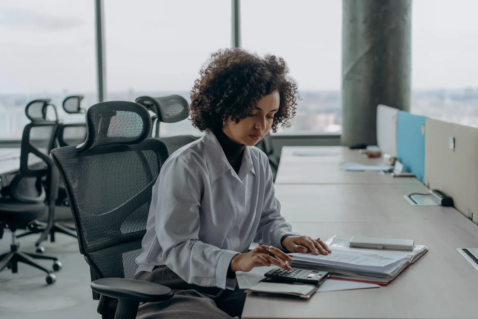 Accountant working with documents at an office desk
